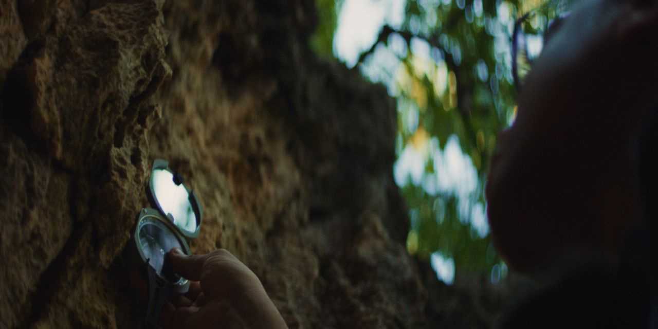 Delcio using a compass.