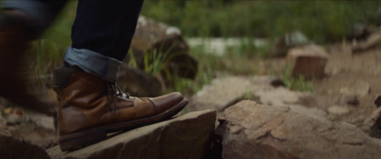 Delcio walking on rocks.
