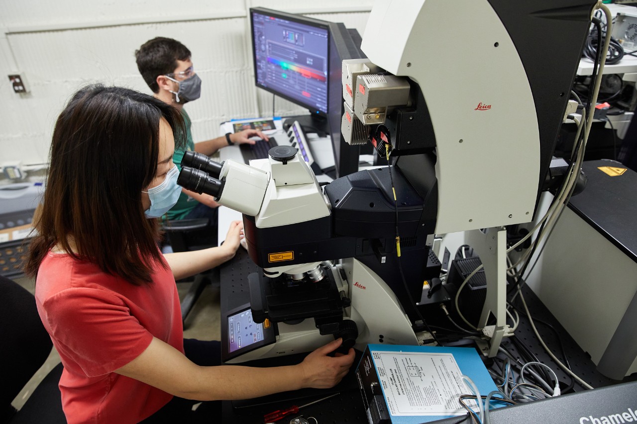Student using microscope, SRNML.