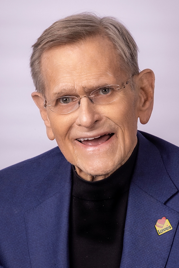 Tom E. Love.