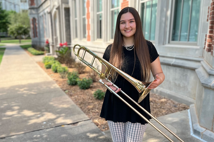 Hope Bellows holding a trombone.