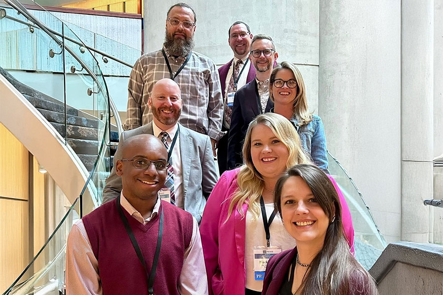 Attendees from the School of Music gathered on a staircase.