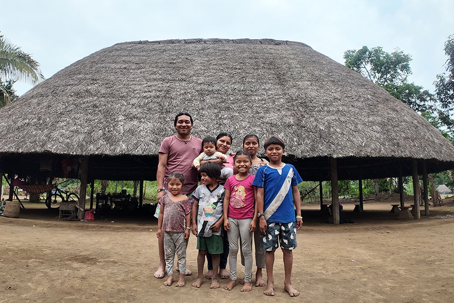 A family standing outside of their Jea.