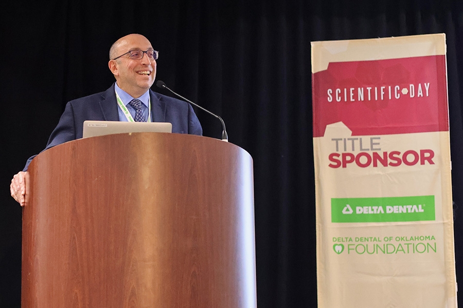 Sharukh Khajotia addresses the crowd at the College of Dentistry Scientific Day 2025.