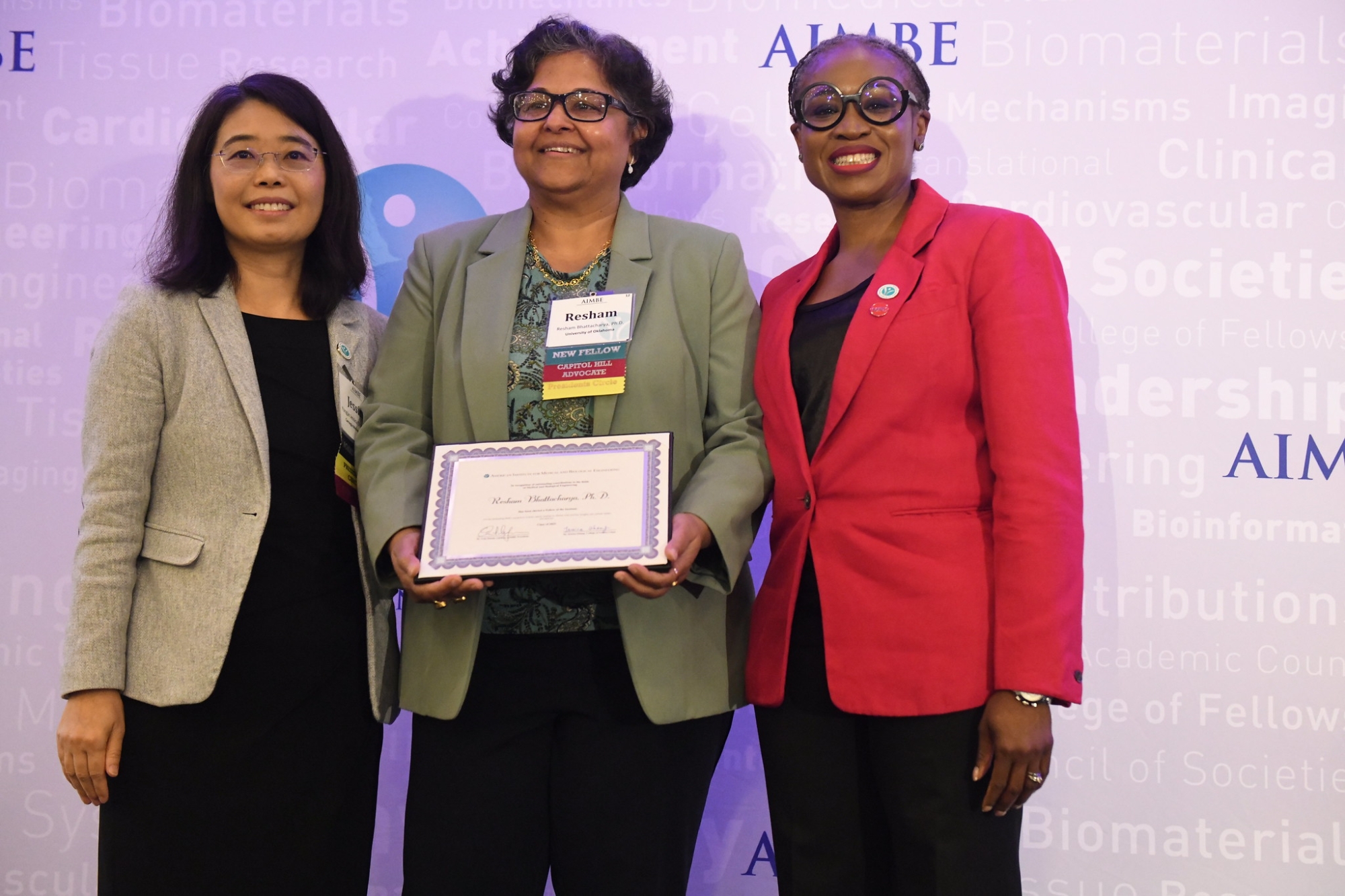 Resham Bhattacharya accepts her AIMBE award.
