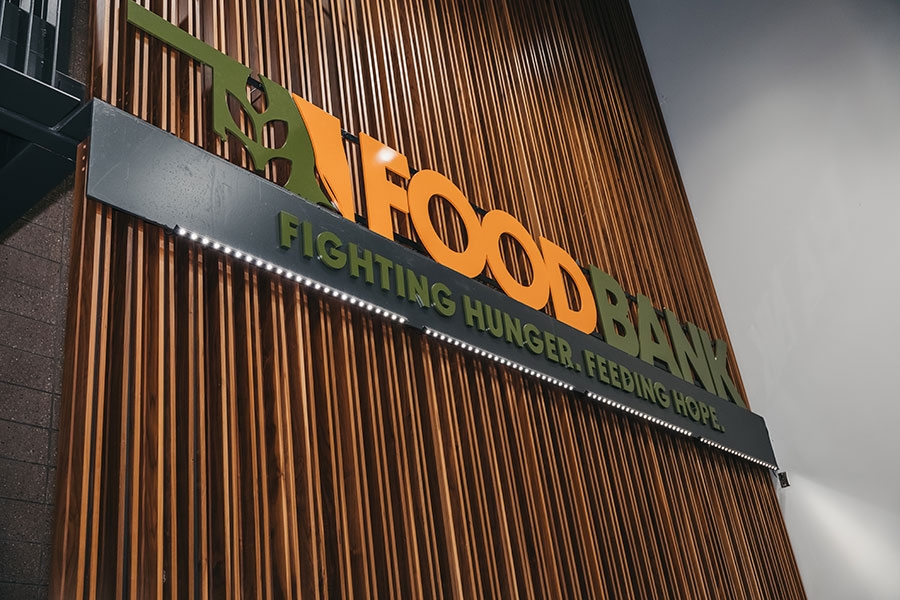 A sign reading "Food Bank. Fighting Hunger. Feeding Hope." 