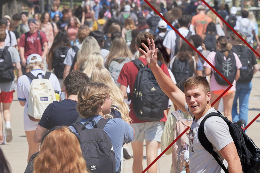 Student waving on campus