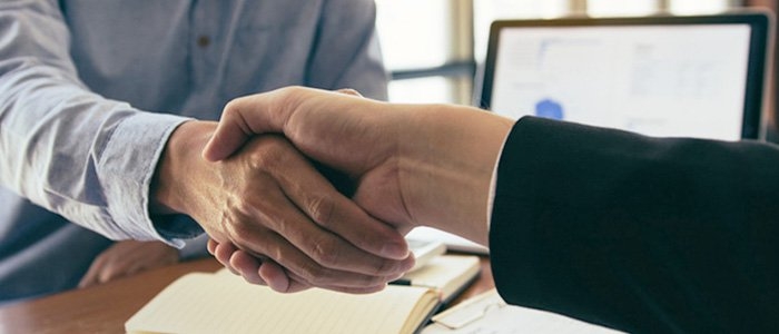 close of of two business mean shaking hands