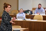 Nancy Sauer teaches a class of students in Augusta 2018 in the Executive MBA in Energy program at the University of Oklahoma.