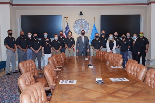 Students in the new Executive MBA in Aerospace and Defense program meet with Oklahoma Gov. Kevin Stitt