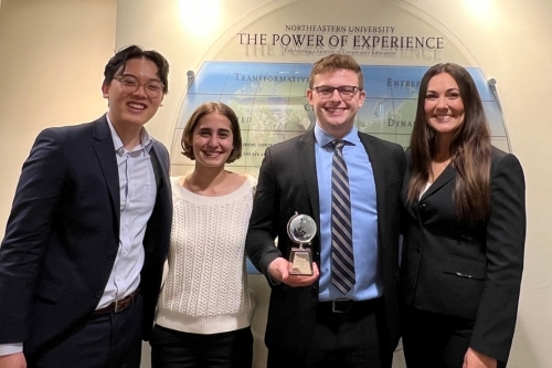 Alan Tran, Gracie Silver, Taylor Smail and Jules Fisher pose with their award from the CUIBE Competition