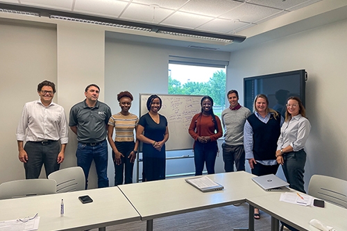 Interns at the Ronnie K. Irani Center pose for photo with mentors