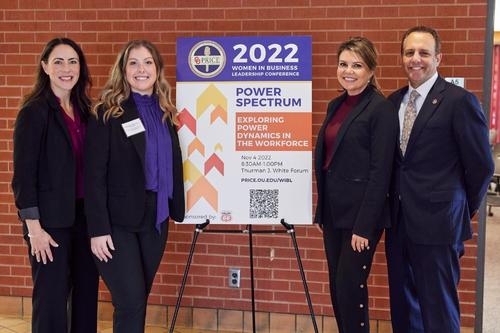 Breea Clark with JCPL conference director Madison Giovenco stand near the conference sign with speaker Ashely Harroz and husband Joe Harroz, jr. OU President.