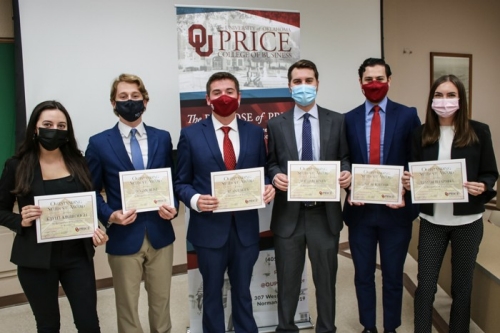 Price College students hold pose with thier certificates for exceptional academic achievement