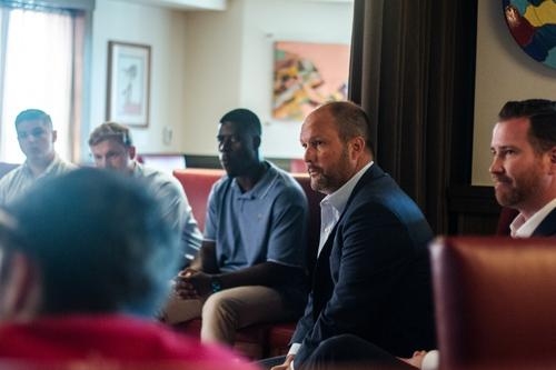 Chad Richardson meets with a group of Price students after his talk "The Entrepreneurial Journey"