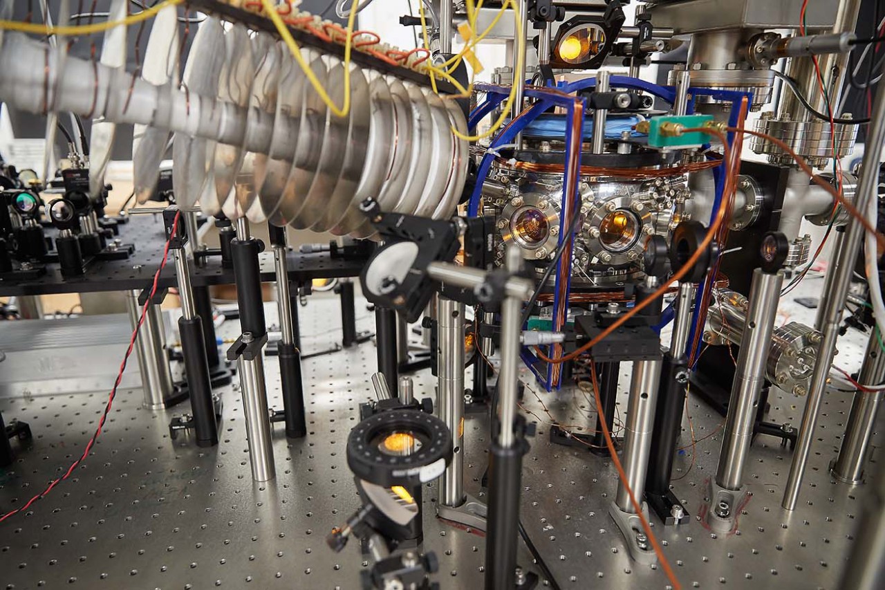 Detail of the vacuum system in which a sodium gas is cooled to ultracold temperatures. Mirrors guide six beams of yellow laser light into the vacuum chamber. 
