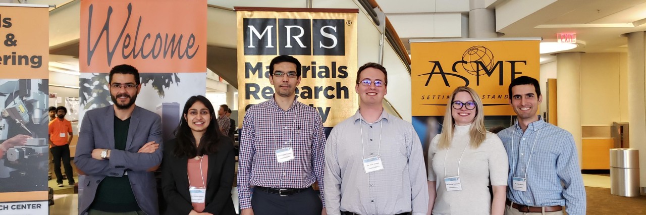 Bayram Saparov (third from left), with his research team, a part of the Oklahoma Photovoltaic Research Institute.