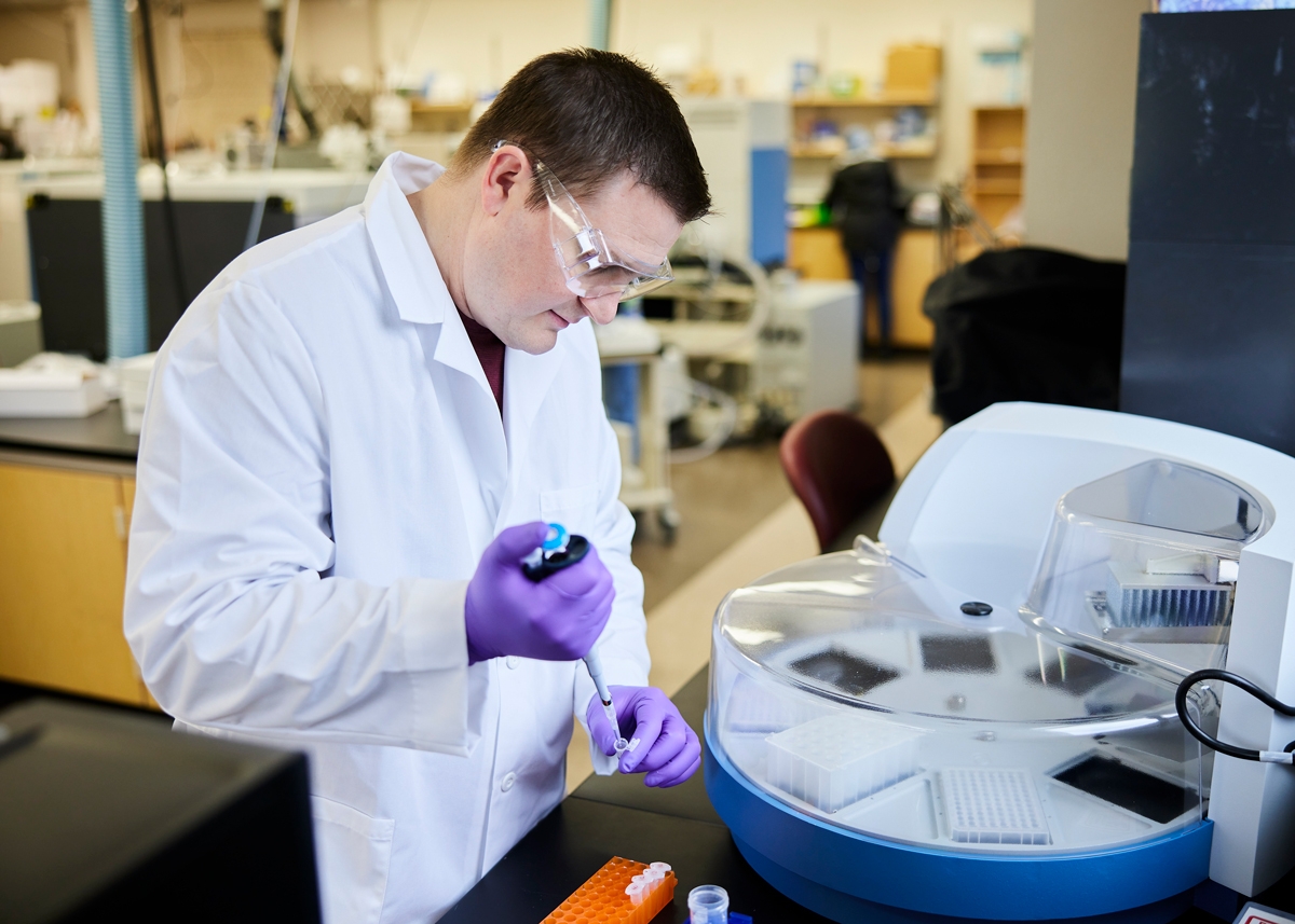 Postdoctoral researcher Jake Kline, Ph.D., demonstrating the KingFisher Flex equipment acquired through the OU Office of the Vice President for Research and Partnerships’ Strategic Equipment Investment Program.