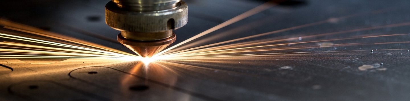 Cutting of metal. Sparks fly from laser