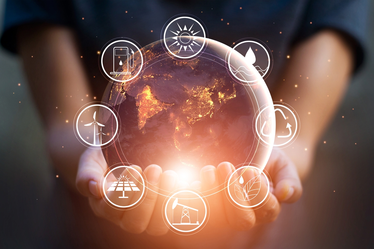 decorative image of person holding globe, green energy