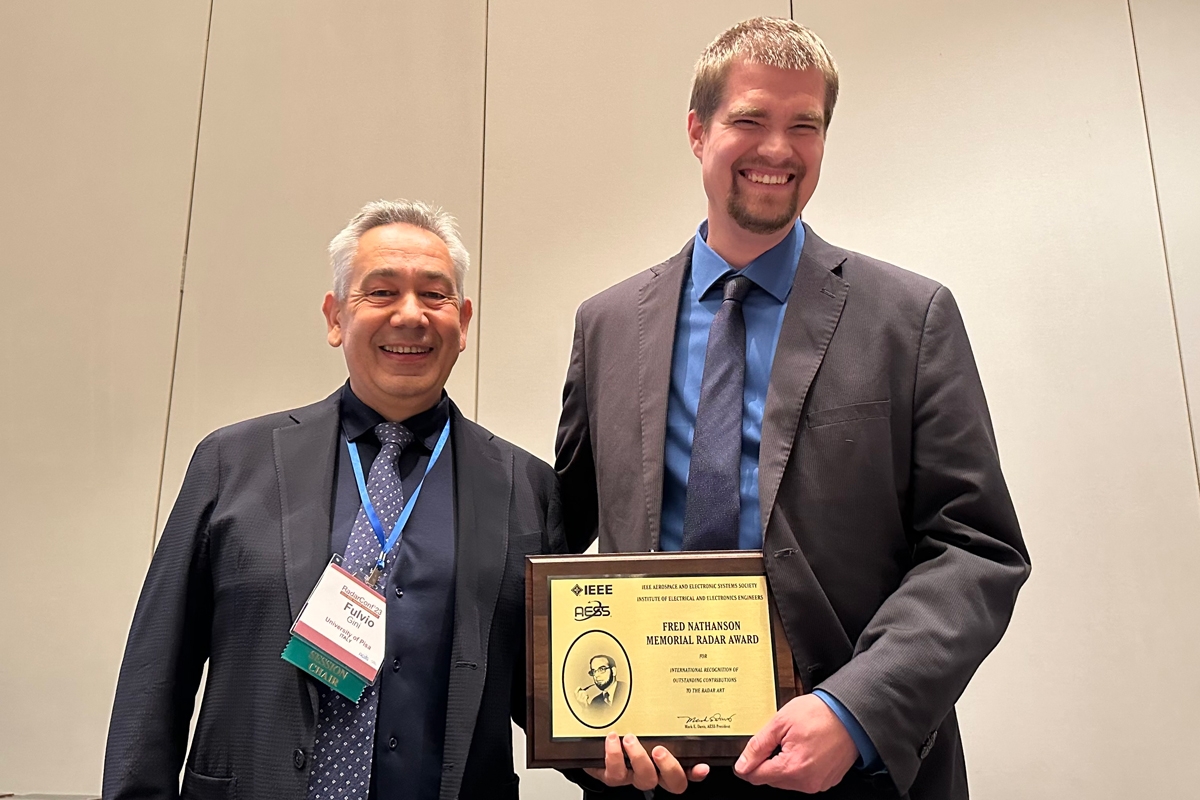 Justin Metcalf (right) with Professor Fulvio Gini (left), IEEE fellow and a representative of the IEEE Aerospace & Electronic Systems Society.