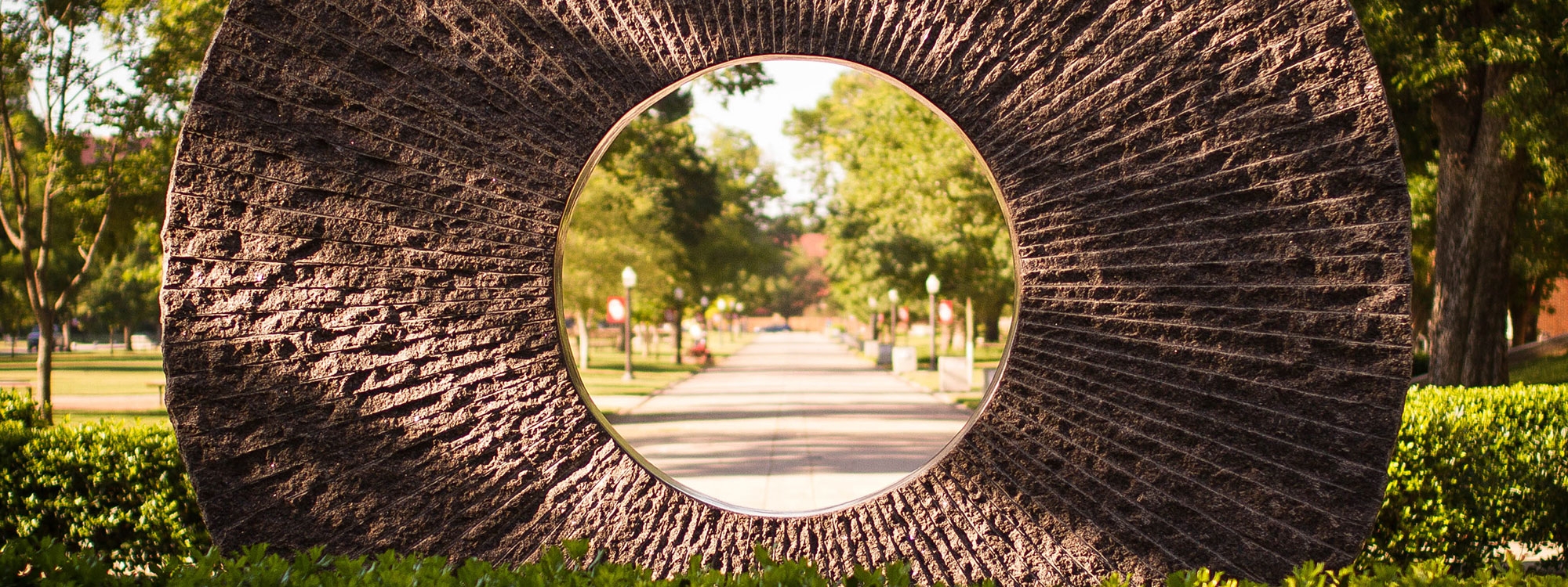 Stone ring sculpture on the South Oval of campus.