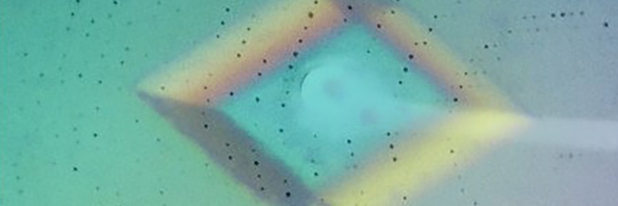 Protein crystal overlaid with its Xray diffraction pattern