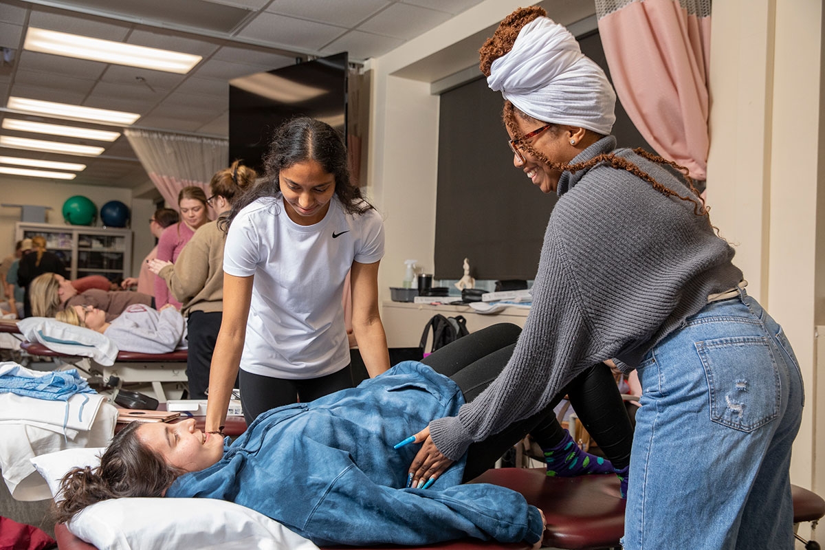 Students work through a physical therapy exercise