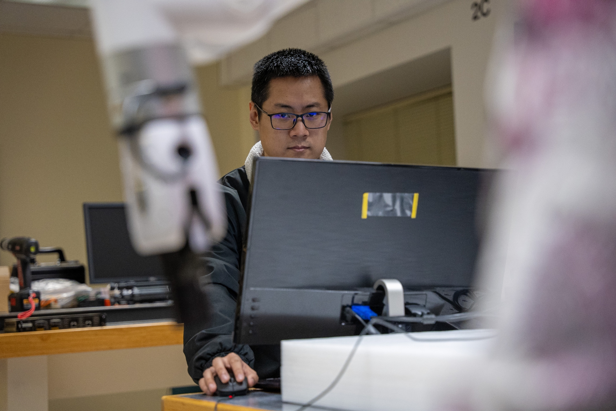 ECE student on computer in lab