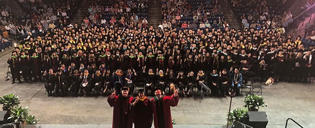 Convocation 2019 A large auditorium filled with graduates smile for the camera