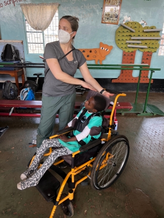 OU-Tulsa Occupational Therapy Student and Kenyan Boy