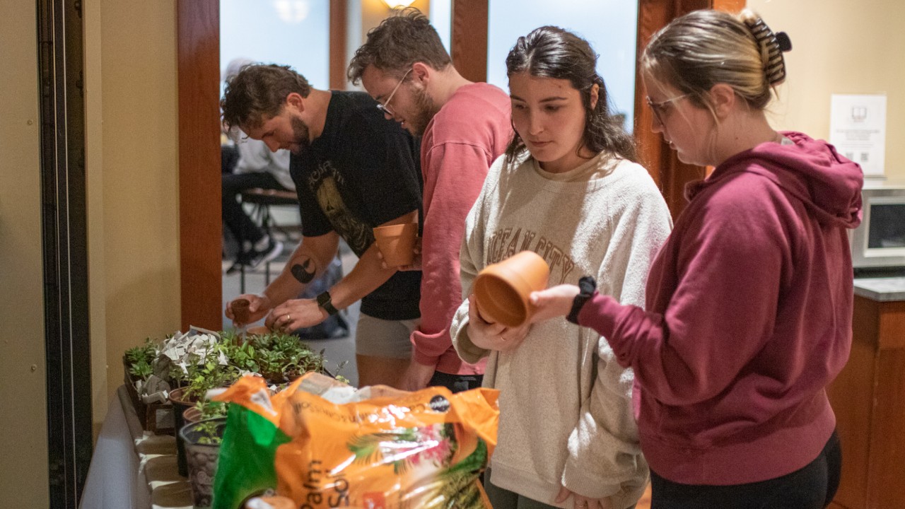 Students picking out pots and plants
