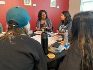 Dr. Belinda Higgs-Hyppolite talking with students